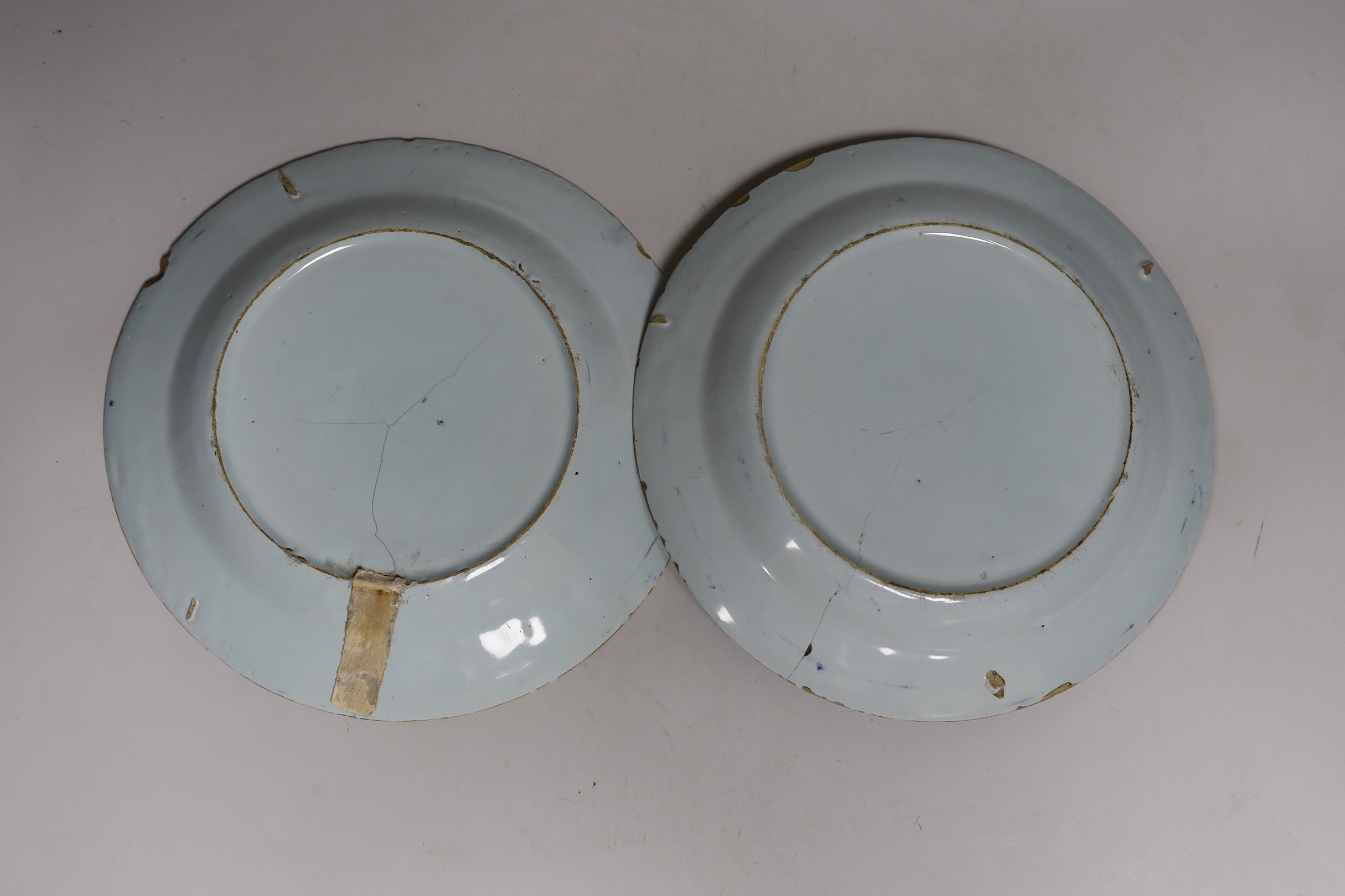 A pair of 18th-century English delftware polychrome plates, 23cm